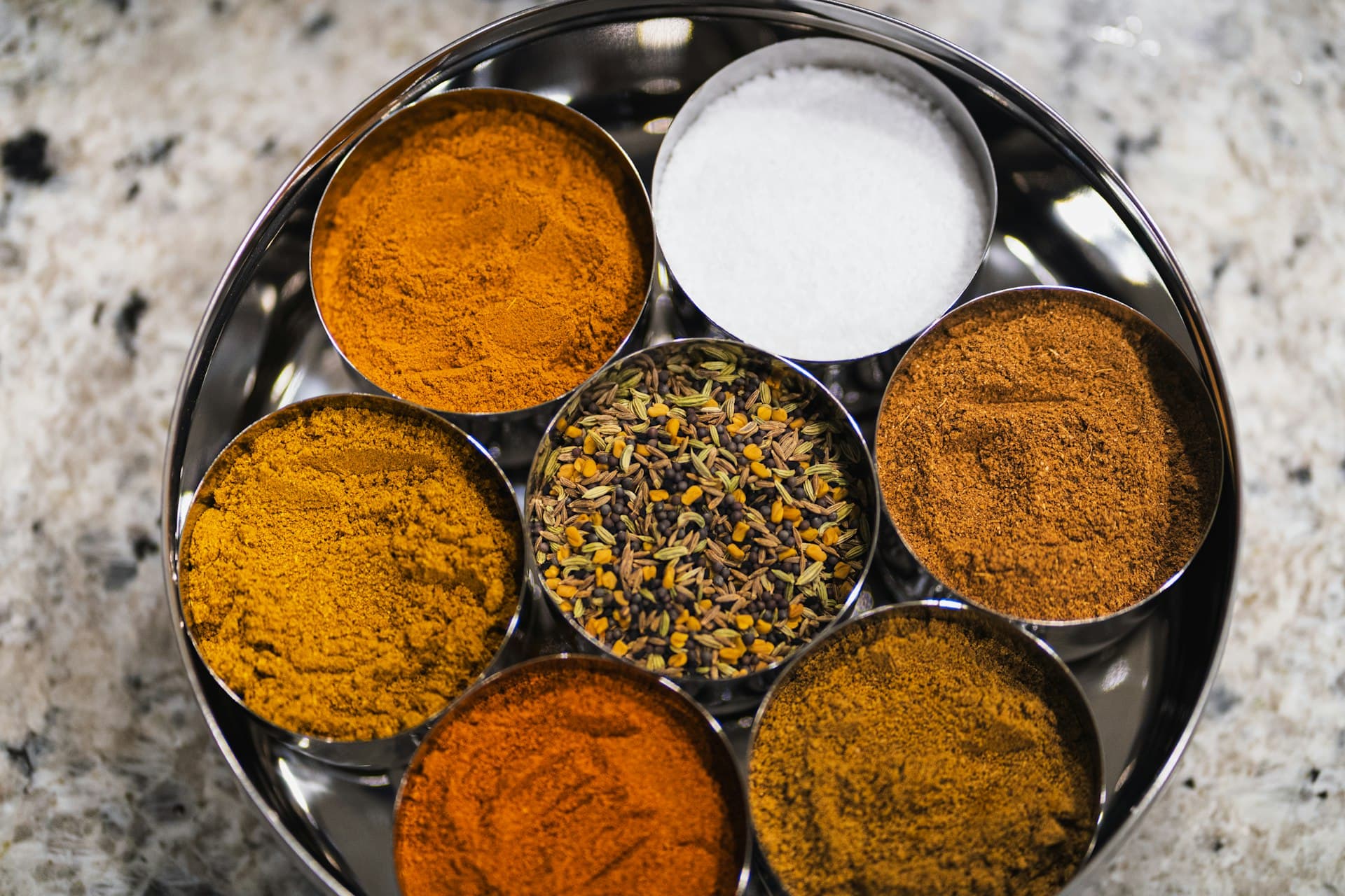 A traditional Indian masala dabba filled with spices